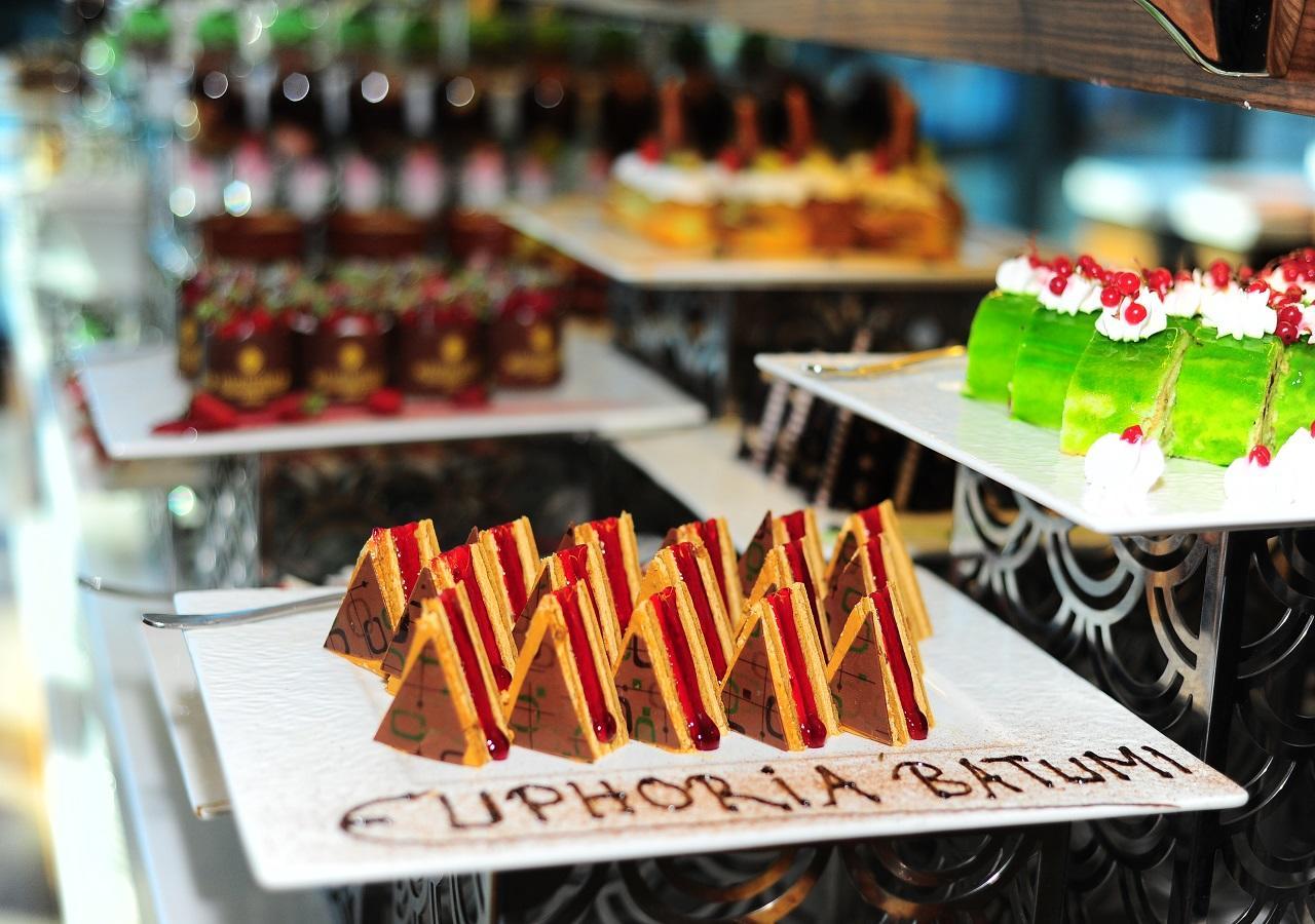 Euphoria Batumi Convention & Casino Hotel Exterior photo A selection of cakes