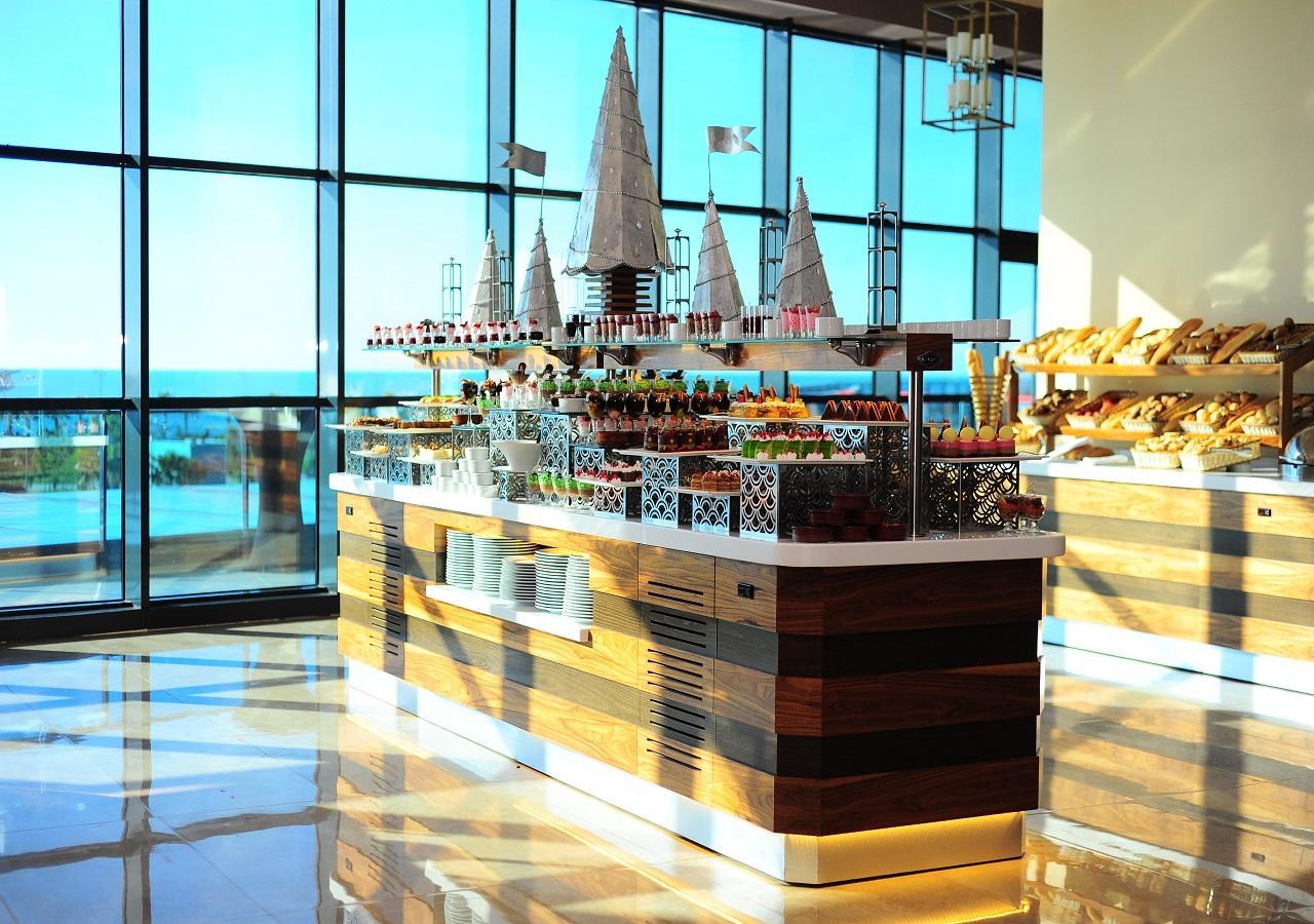 Euphoria Batumi Convention & Casino Hotel Exterior photo The buffet at the 360° restaurant