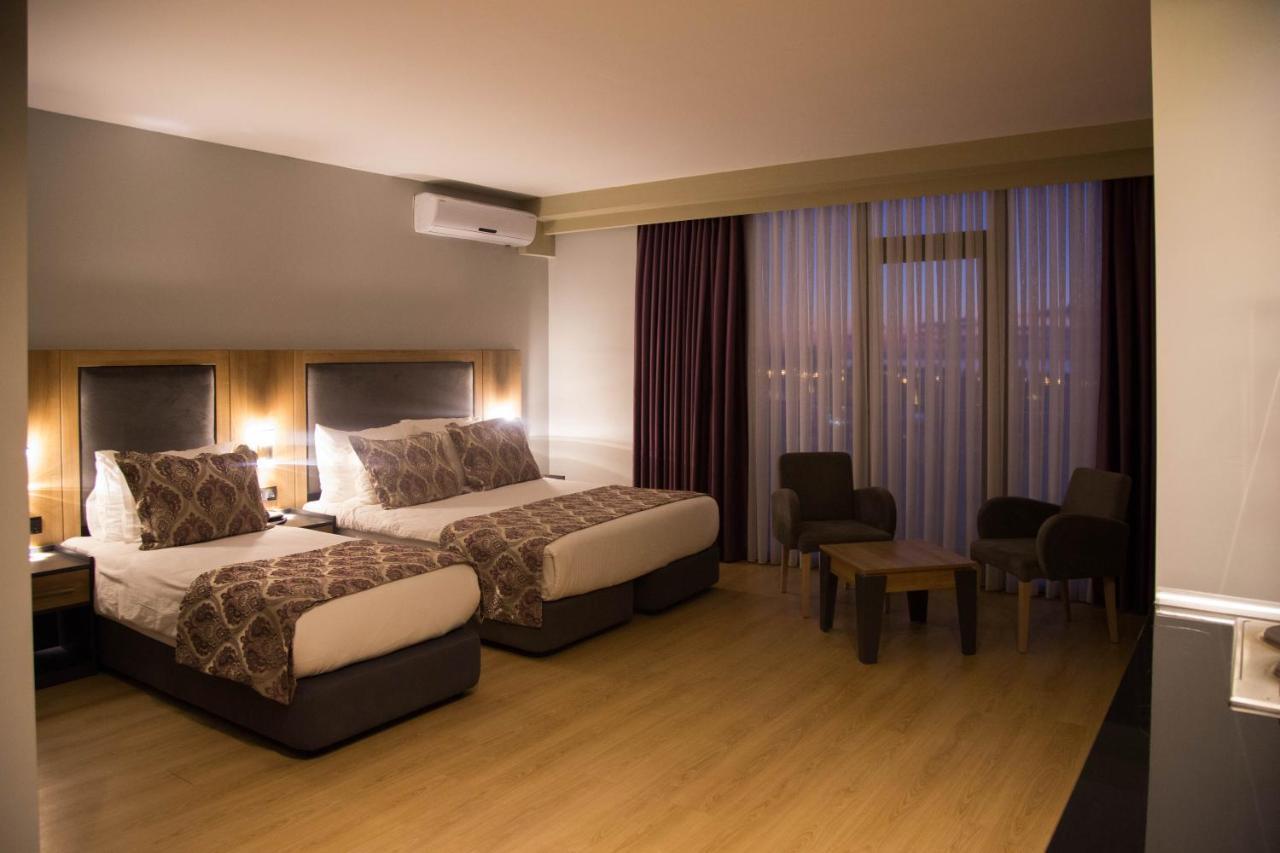 Euphoria Batumi Convention & Casino Hotel Exterior photo A room at the hotel